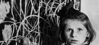 Image of a girl in front of a drawing