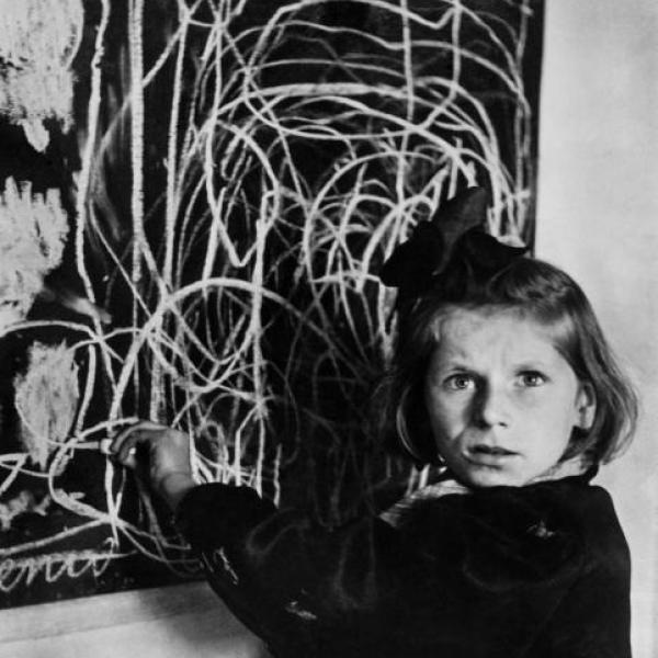 Image of a girl in front of a drawing
